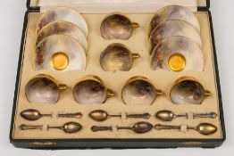 A cased set of six Royal Worcester cups and saucers by Harry Stinton: the interior and upper
