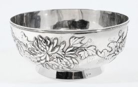 A Chinese silver bowl, maker WA,:  of circular form the sides decorated with chrysanthemums,