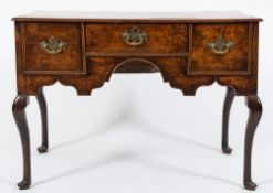 An 18th Century oak lowboy:, with a rectangular moulded top,