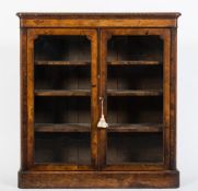 A Victorian walnut, crossbanded and inlaid low display cabinet:, bordered with boxwood lines,