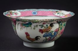 A Chinese porcelain famille rose cockerel bowl: the finely potted circular bowl with notched rim,
