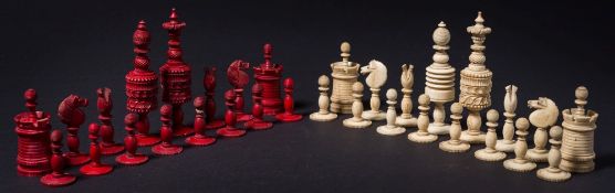 A 19th century bone Barleycorn style chess set: one side stained red, the other  left natural,
