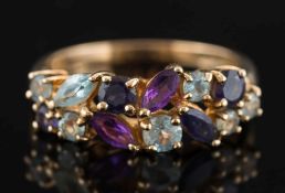 A modern 9ct gold and gem-set dress ring: mounted with marquise shaped amethysts and aquamarines,