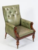 A Victorian carved mahogany and green leather upholstered library armchair:,