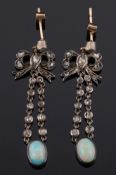 A pair of oval opal and rose diamond drop earrings: with bow motif, approximately 44mm total length.
