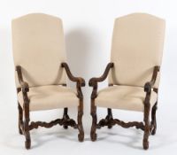 A pair of late 17th/early 18th Century carved walnut open armchairs:,