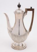 A late Victorian silver coffee pot, maker William Comyns & Son, London,