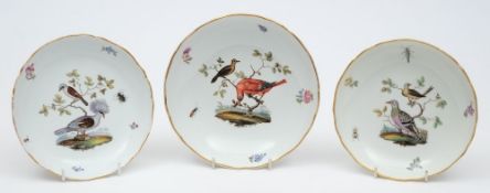 Three Meissen porcelain saucer dishes: each enamelled with two birds on a leafy branch amongst