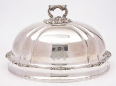 A late Victorian plated meat dish cover: crested, of domed oval outline,