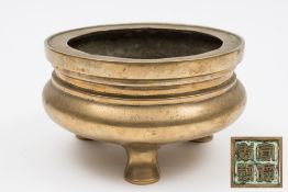 A Chinese bronze tripod censer: with flattened rim and on short pad feet, cast four-character mark,