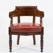 A Victorian mahogany tub-shaped library armchair:,