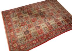 A Persian carpet of Bakhtiar design:, the compartmented field with panels of mimosa tress,