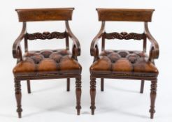 A pair of Regency carved mahogany elbow chairs:,