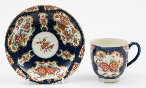 A Worcester coffee cup and saucer: painted in the 'Rich Kakiemon' pattern with banded hedges and