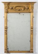 A 19th Century giltwood and gesso pier mirror:, with recessed broken cornice,