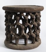 Cameroon, Bamileke, stool: with circular seat supported by three tiers of carved bats heads,