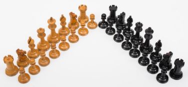 A boxwood Staunton pattern chess set: one side left natural, the other side ebonised,