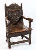 A 17th Century (or later) carved oak open armchair:,