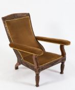 A 19th Century Indian carved teak open armchair:,