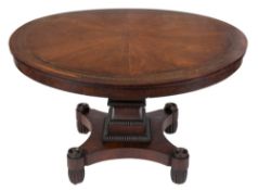 A Regency mahogany and brass inlaid circular dining table:,