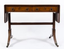 A 19th Century mahogany and inlaid sofa table:, bordered with boxwood lines,