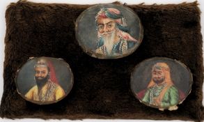 A set of three Indian miniature ivory oval plaques: depicting Chuttah Sing, Gholab Sing and Mulraig,