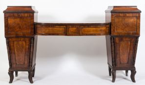 A Regency mahogany twin-pedestal sideboard:, of bowed breakfront outline,