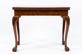 A 19th Century walnut rectangular card table:, the baize lined hinged top with a moulded edge,