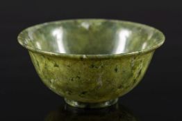 A Chinese spinach green jade bowl: of flaring form with short foot rim,