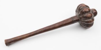 A Fijian Ula throwing club: of traditional design with ribbed bulbous head and tapering shaft, 44cm.