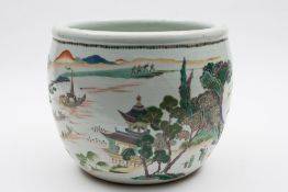 A Chinese famille verte jardiniere: painted with a continuous extensive lake landscape with pagodas,