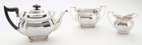 A George V silver three-piece tea service,  maker Joseph Ridge, Sheffield, 1927/28: crested,