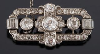 A 20th century platinum and diamond mounted plaque brooch:, pave-set with circular,