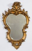 A 19th Century Continental carved giltwood cartouche shaped wall mirror:,