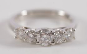 A platinum and diamond five-stone ring: with graduated circular brilliant-cut diamonds estimated to