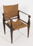 A Rourkhee campaign chair:, with turned wood frame,