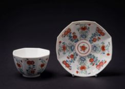 A Chelsea 'Kakiemon' teabowl and saucer: of shaped octagonal form, painted in blue,