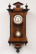 A small Vienna-style wall timepiece: the spring-driven movement having a three-rod pendulum and a