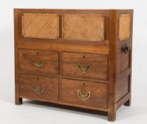 A 19th Century child's teak and cane panelled rectangular cot:, with four short drawers below,