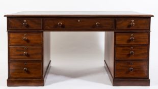A 19th Century mahogany partner's pedestal desk:, the rectangular top with a moulded edge,