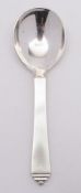 A Georg Jensen 'Pyramid' pattern silver preserve spoon: Jensen stamped marks GI,