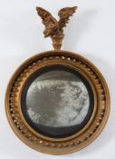A 19th Century (or later) gilt decorated circular convex mirror:,