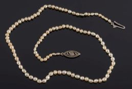 A natural seed pearl, single string necklace: approximately 42cm long, with marcasite clasp.