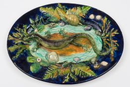 A French Palissy Ware dish: of oval form, modelled with a lizard,
