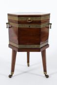 A George III mahogany brass bound and inlaid hexagonal wine cooler:,