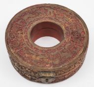 A 19th century Chinese circular lacquer hat box: decorated with gilt fret carved panels of birds