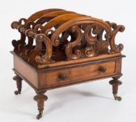 A Victorian carved rosewood three-division canterbury:,