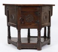 A 18th Century oak Credence table:, with an octagonal hinged top,