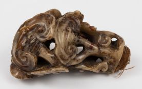 A Chinese carved soapstone staff handle: Ming period, carved in the form of stylised trees, 11cm.