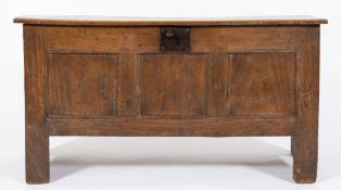 An 18th Century oak rectangular coffer:, the hinged moulded top with thumb gouged ends,